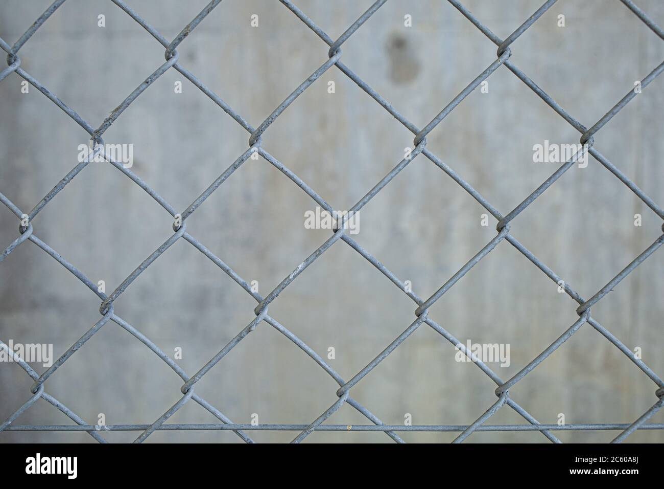 An old wire mesh with a diamond pattern. Stock Photo