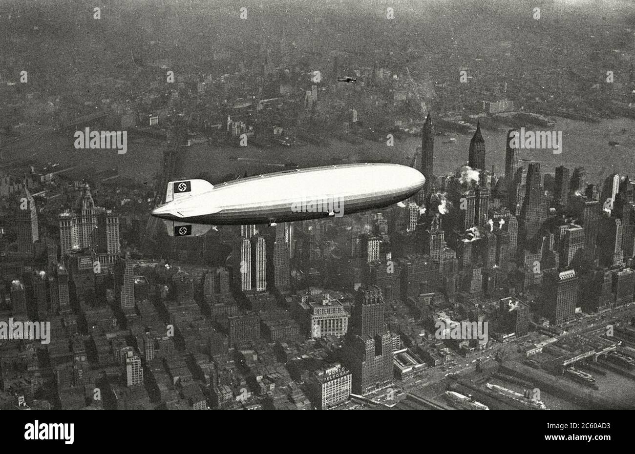 The German airship Hindenburg flies over Manhattan on may 6, 1937. In a few hours the ship will light up when you try to land Stock Photo