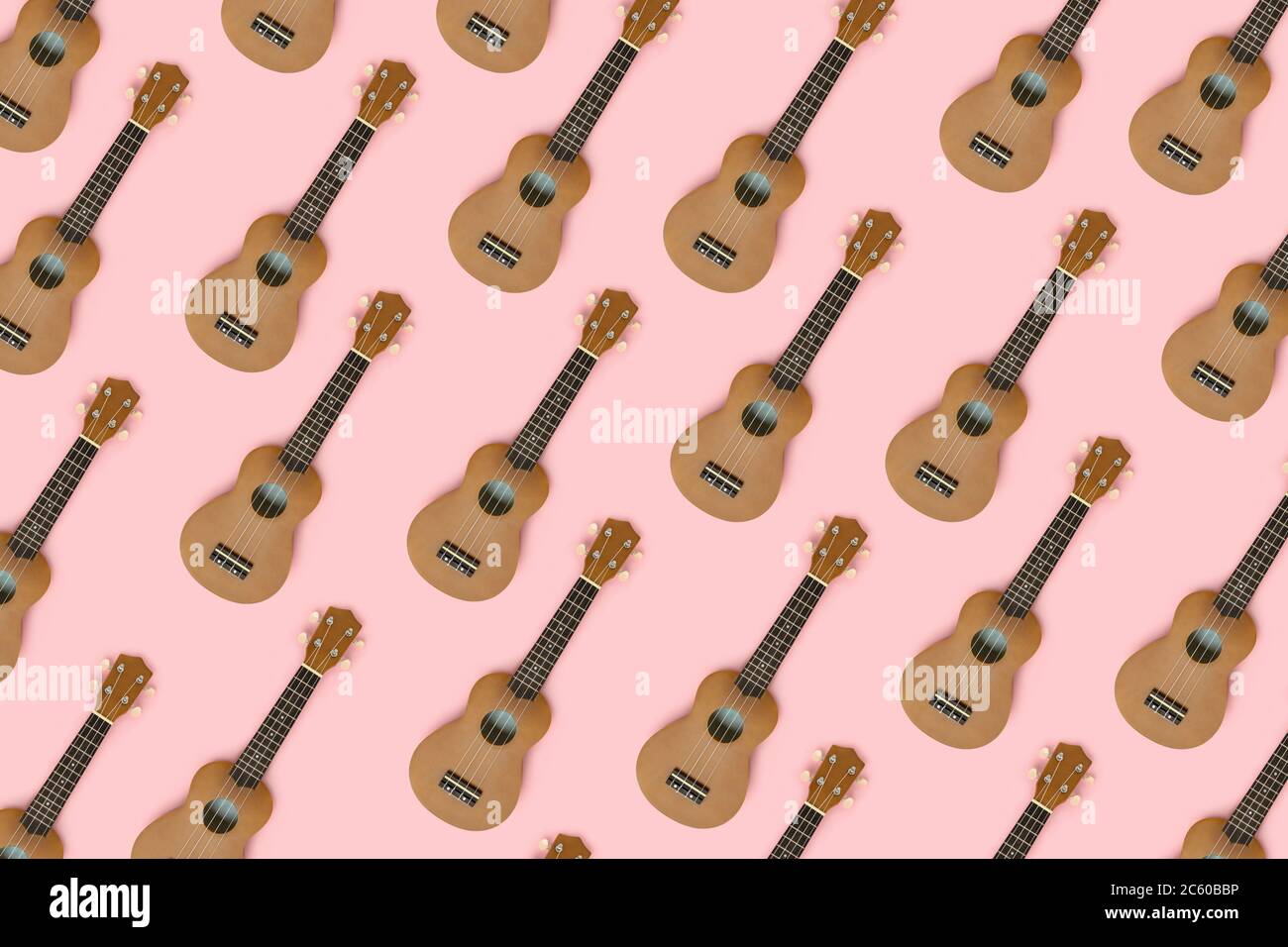 Hawaiian guitars pattern on a pink pastel background. Creative layout. Stock Photo