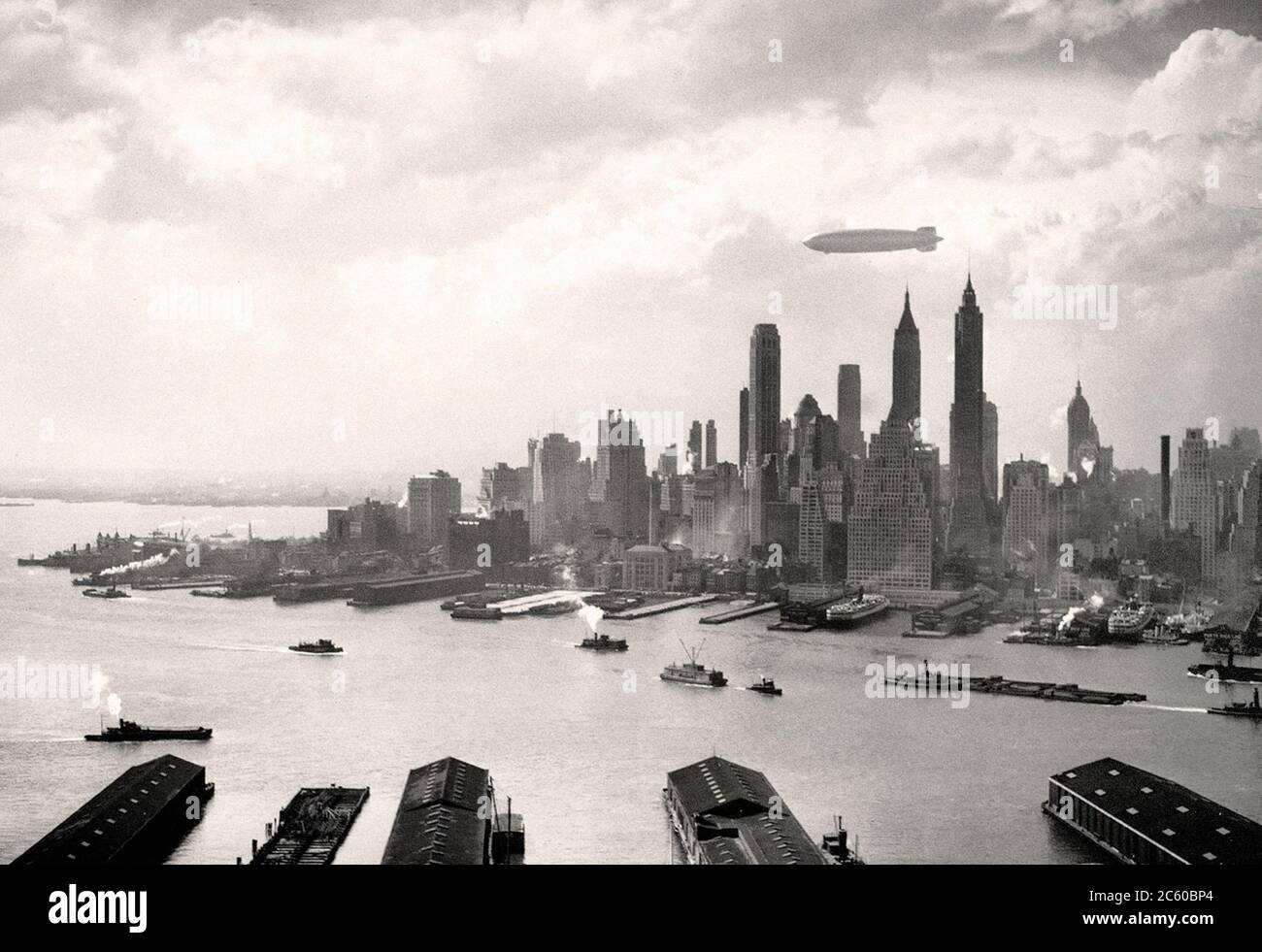 The German airship Hindenburg flies over Manhattan on may 6, 1937. In a few hours the ship will light up when you try to land Stock Photo