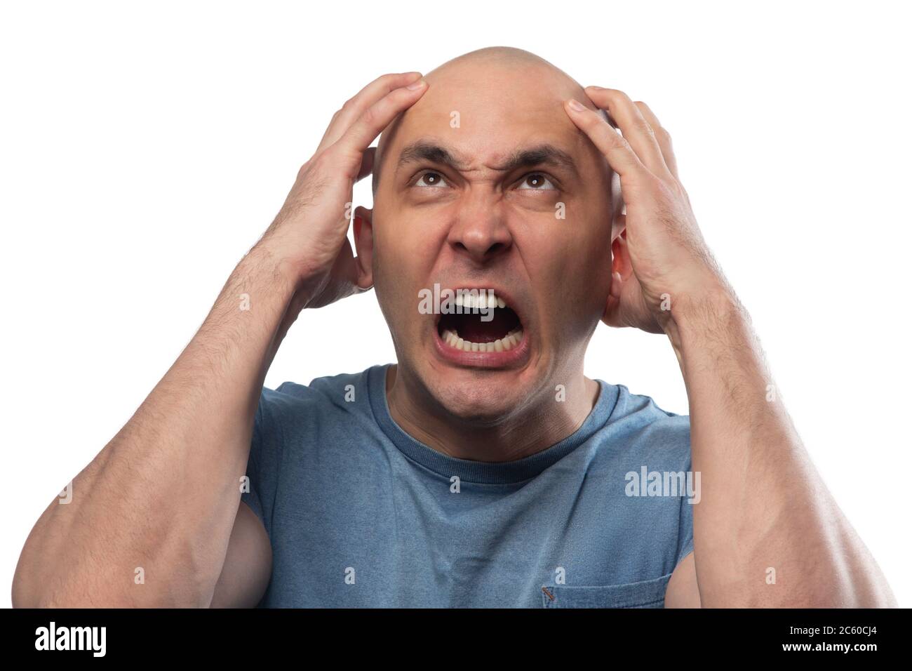 Photo of young bald angry screaming man Stock Photo