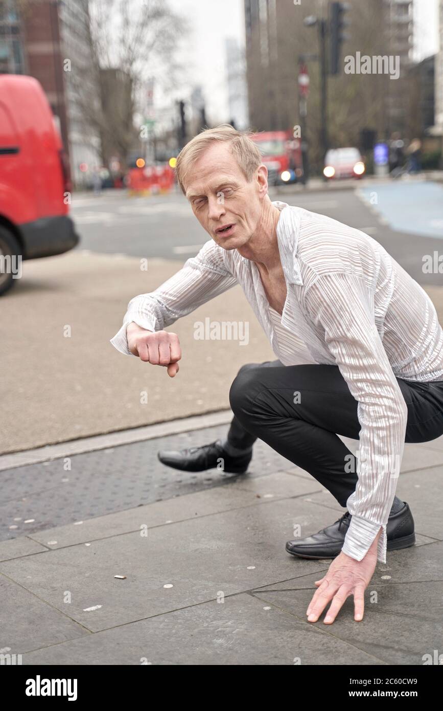 assertive man feeling inner world at street in London, England, Great Britain Stock Photo