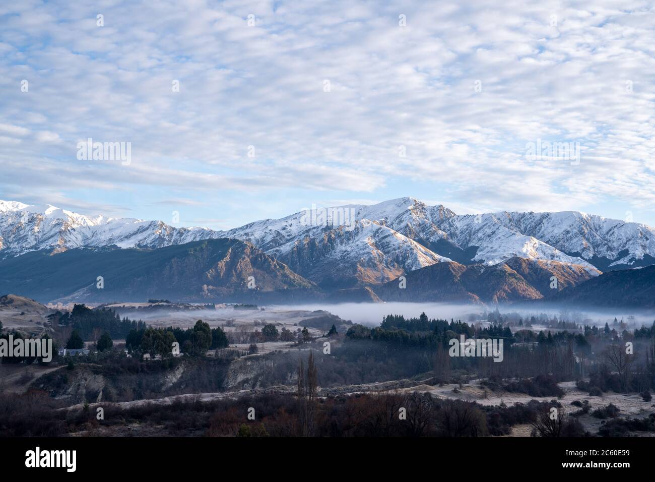 Panorama of Snow Mountain Range Landscape with Blue Sky background from New Zealand. Stock Photo