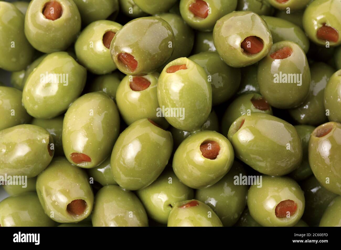 Green olives stuffed with red chilli peppers. Sicilian Food Stock Photo