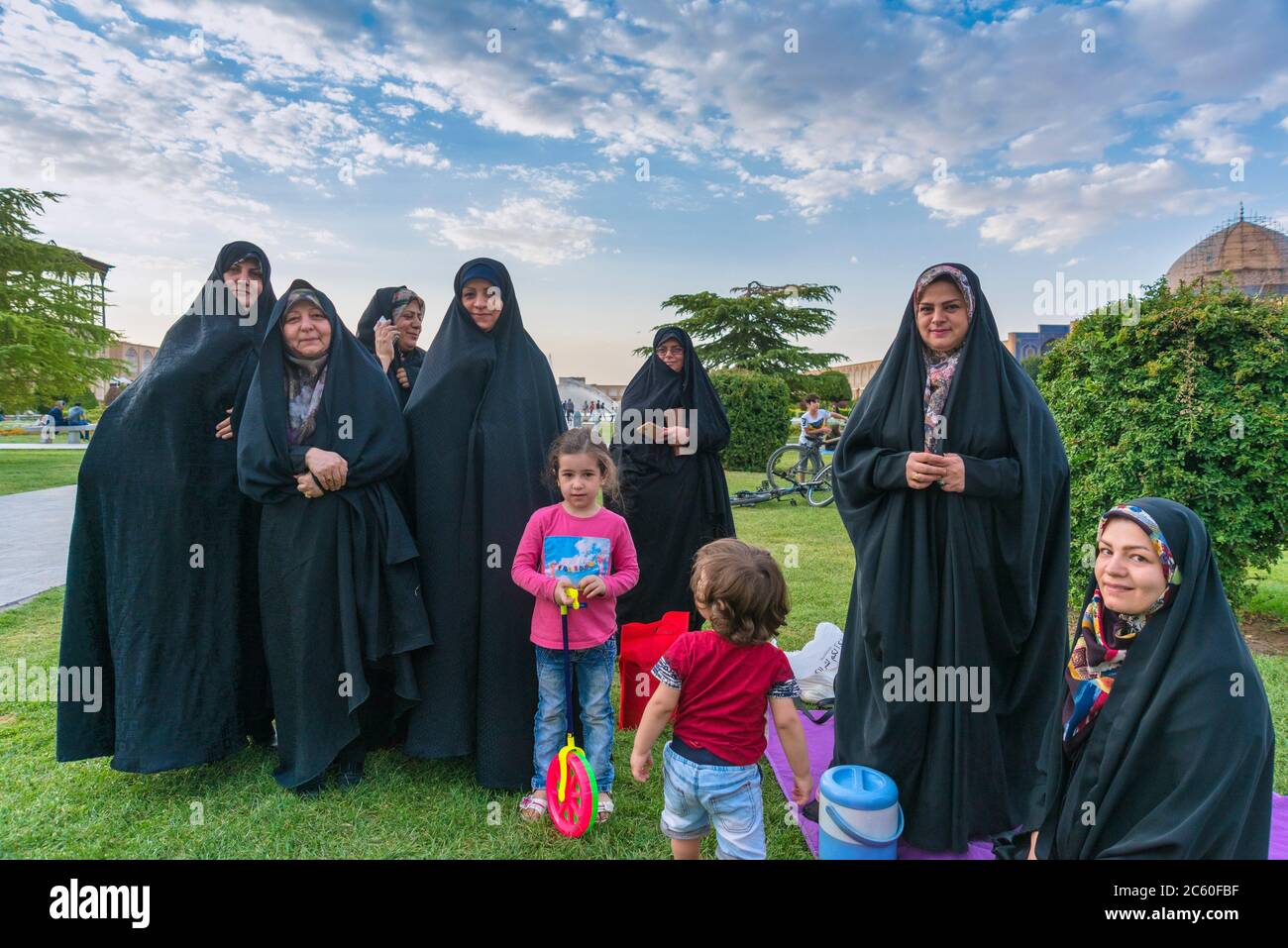 Women in the Imam Square (Meidan-e Emam) in the Iranian city of Isfahan. Stock Photo