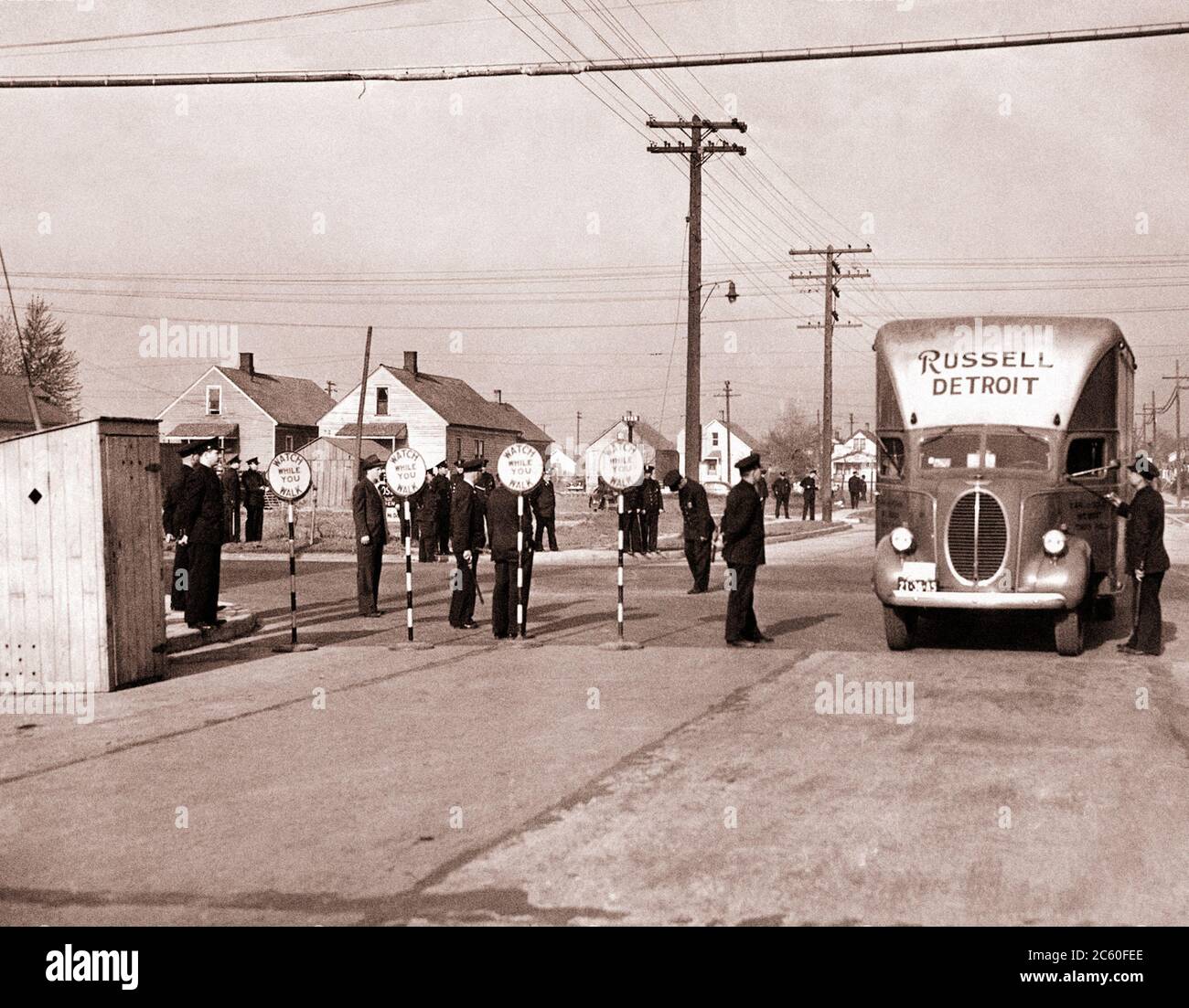 1942. More than 1,500 city and state military and police officers guard camper-hauled black out-of-towners who are being resettled, as part of a Feder Stock Photo