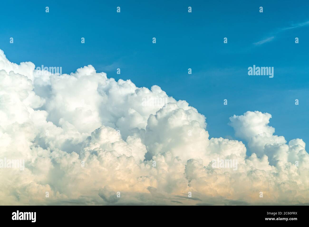 White fluffy clouds on blue sky. Soft touch feeling like cotton. White puffy clouds cape with space for text. Beauty in nature. Close-up white cumulus Stock Photo