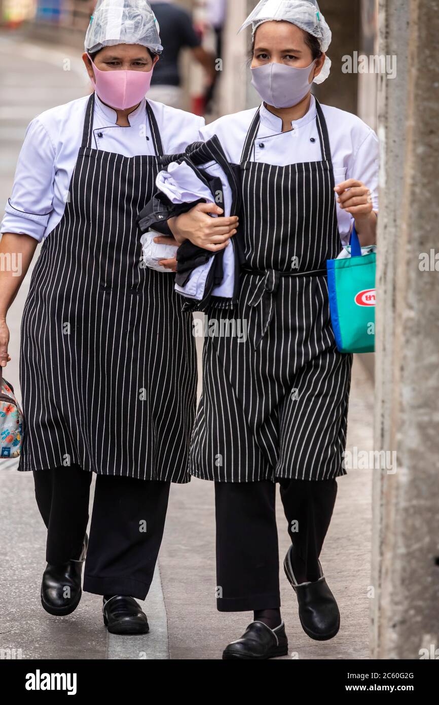 Chefs from restaurant wearing face mask during covid 19 pandemic, Bangkok, Thailand Stock Photo