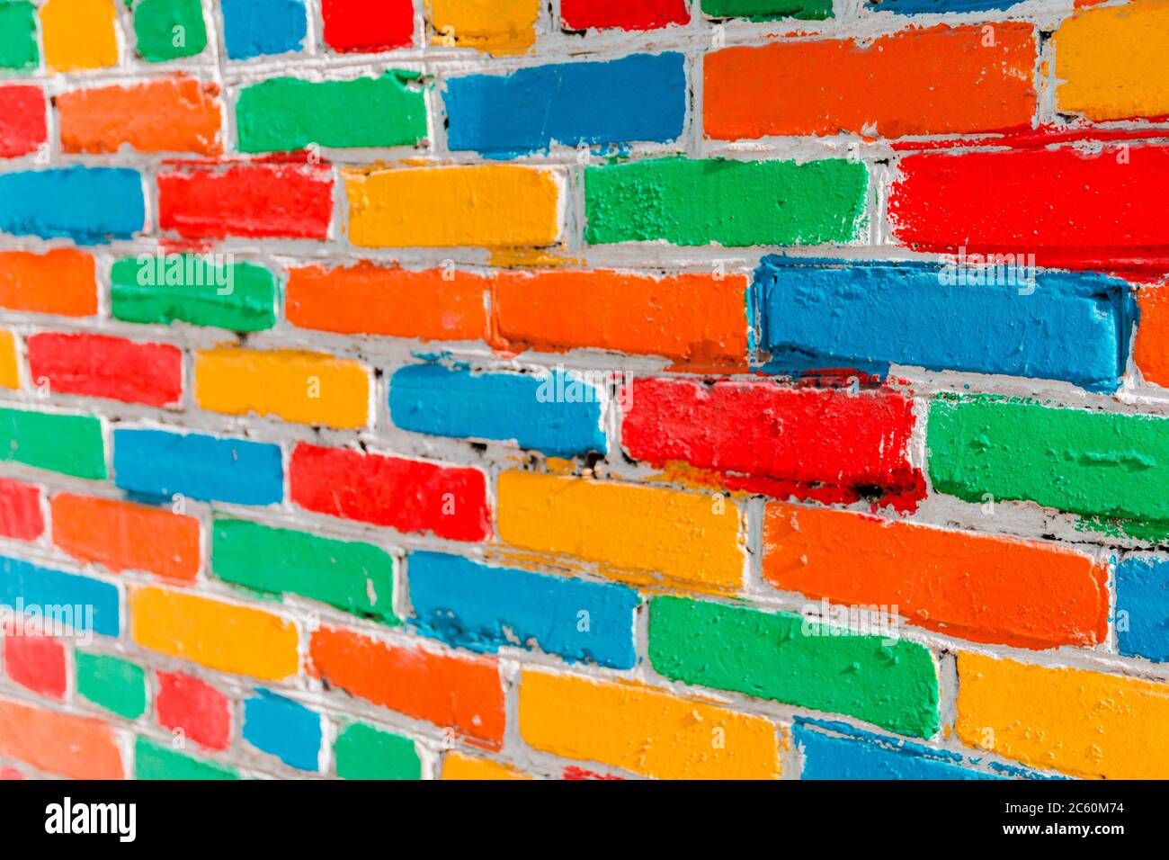 bright colorful multi-colored painted brick texture background, selective focus. Stock Photo