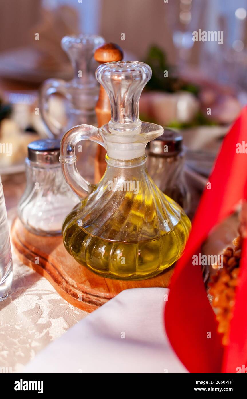 carafe olive oil on a festive table Stock Photo