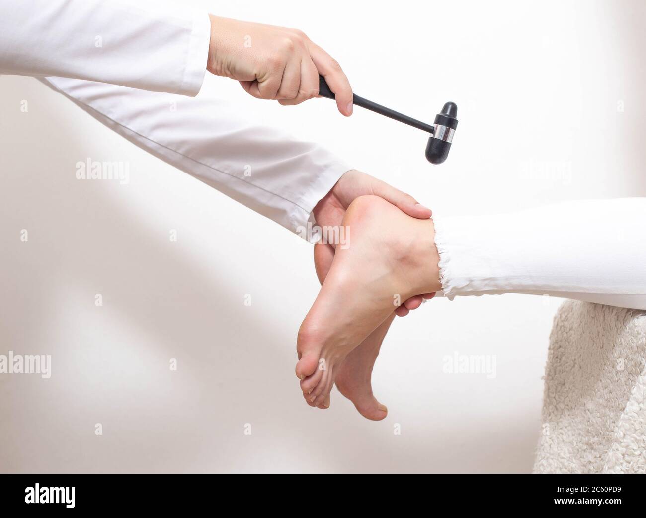 Checking the patient's Achilles reflex for the presence of a compressed