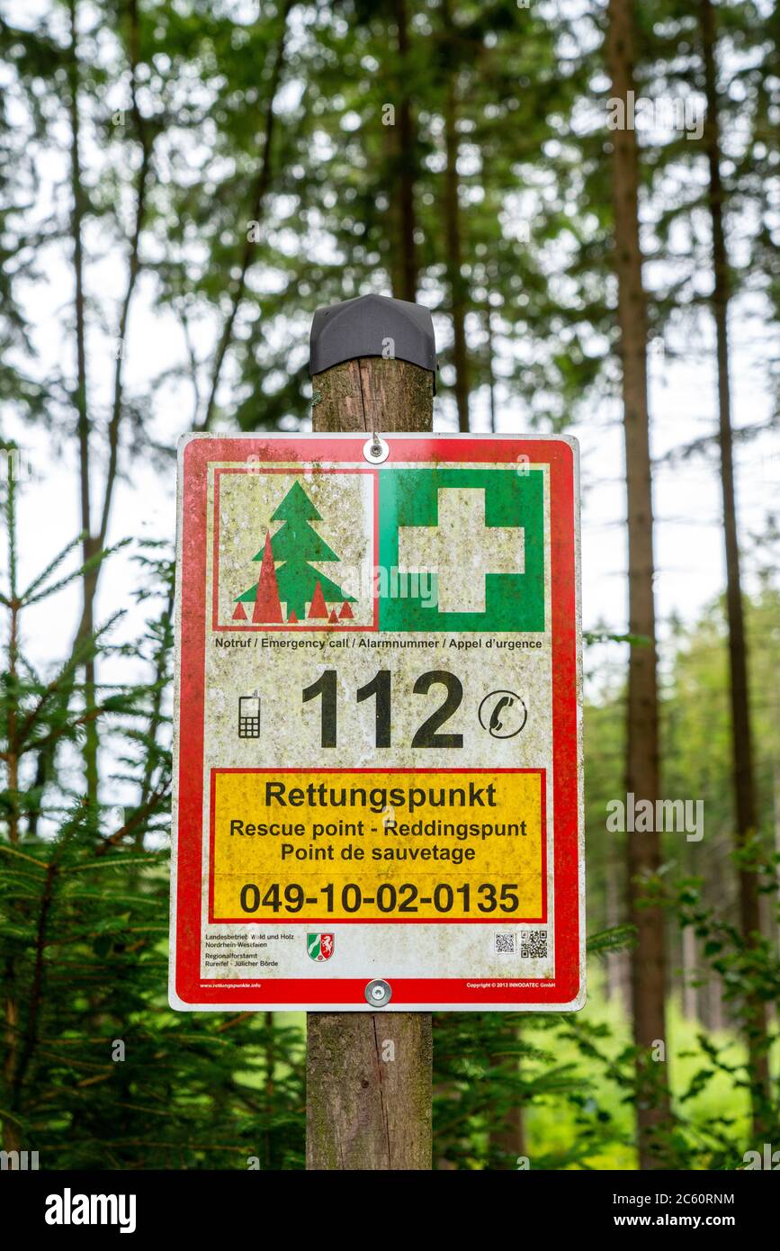 Rescue point system in German forests, on boards locations are indicated, which can be given in an emergency, the rescue services to guide them to an Stock Photo