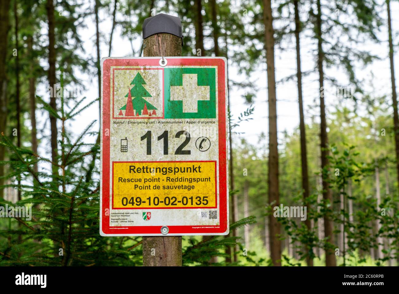 Rescue point system in German forests, on boards locations are indicated, which can be given in an emergency, the rescue services to guide them to an Stock Photo