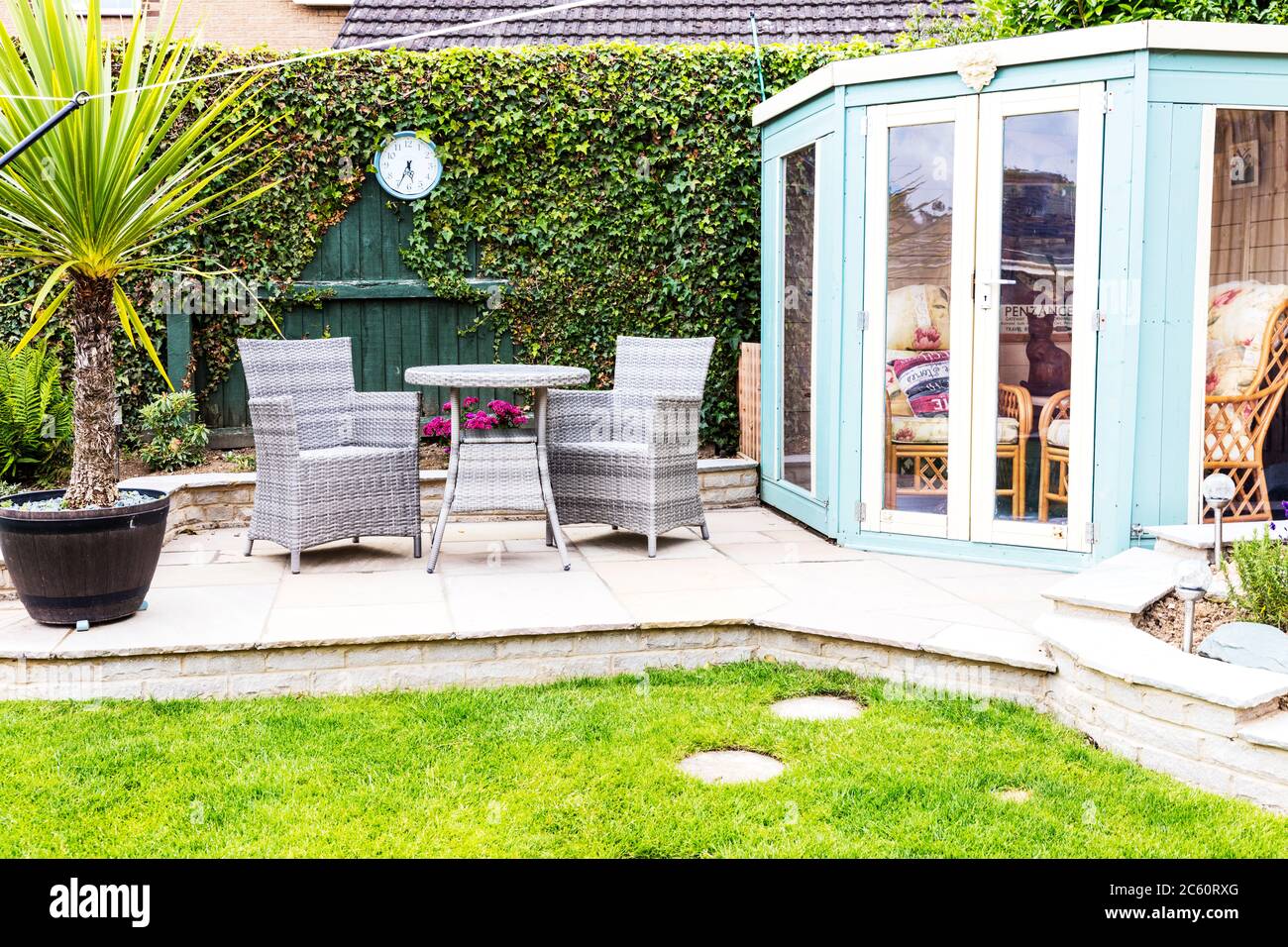 Garden patio, patio set, patio table, patio table and chairs, summerhouse, garden, patio, patio UK, garden summerhouse, outside table, chairs, table, Stock Photo