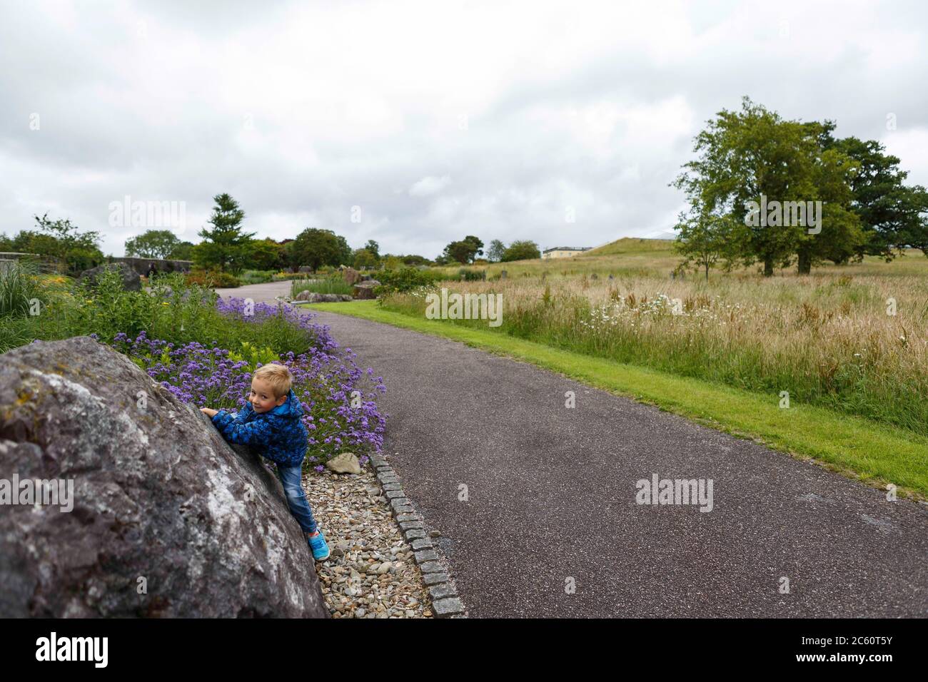 Llanarthne, UK. 6 July, 2020. As outdoor visitor attractions open and the five mile travel restriction is lifted in Wales, a child plays at the National Botanic Garden of Wales. Credit: Gruffydd Ll. Thomas/Alamy Live News Stock Photo