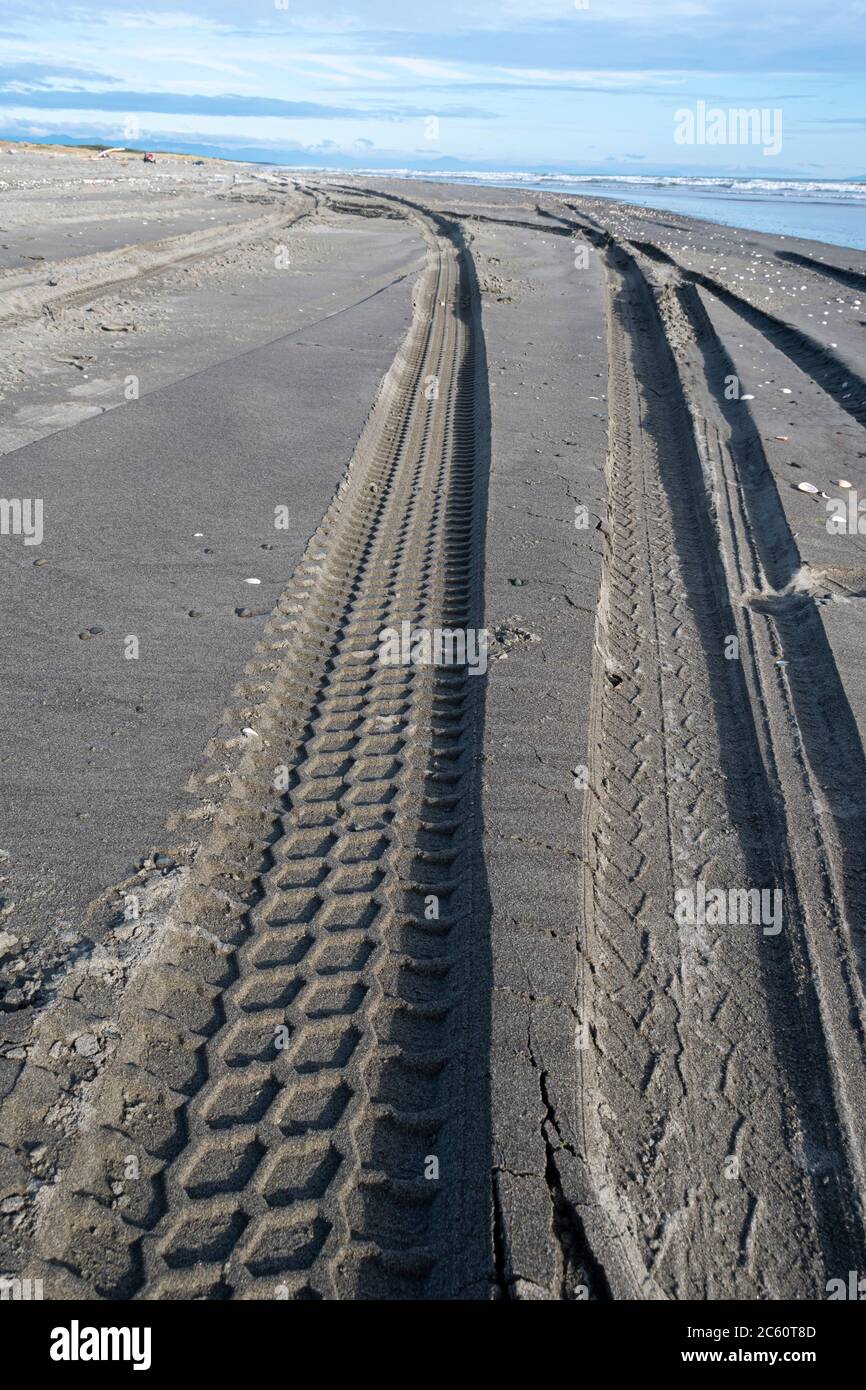 Tyre tracks in sandy beach at Tangimoana, Manawatu, North Island, New Zealand Stock Photo