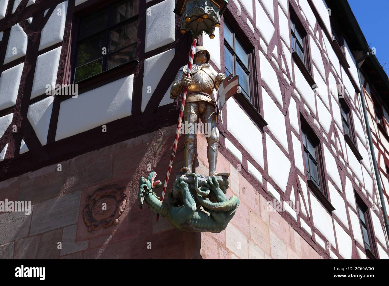 Nuremberg, Germany. 500 year old medieval statue of Saint George the knight, slaying a dragon. Stock Photo