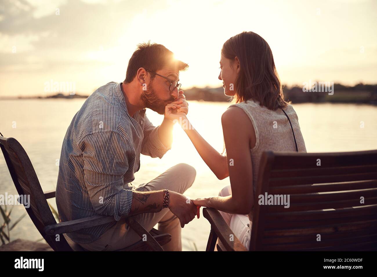 Man kissing hand woman hi-res stock photography and images - Alamy