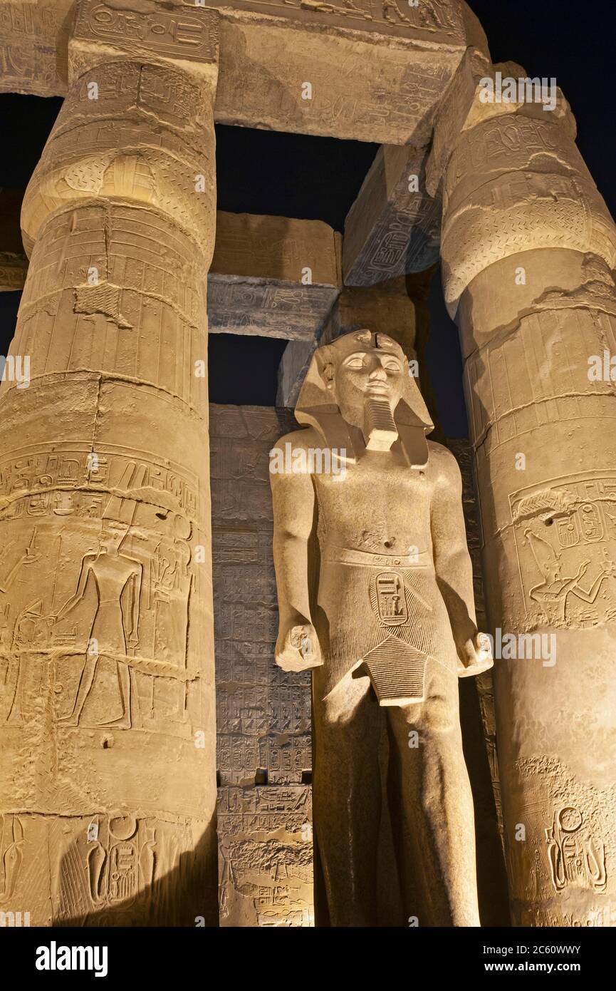 Large statue of Ramses II with columns in hypostyle hall at ancient ...