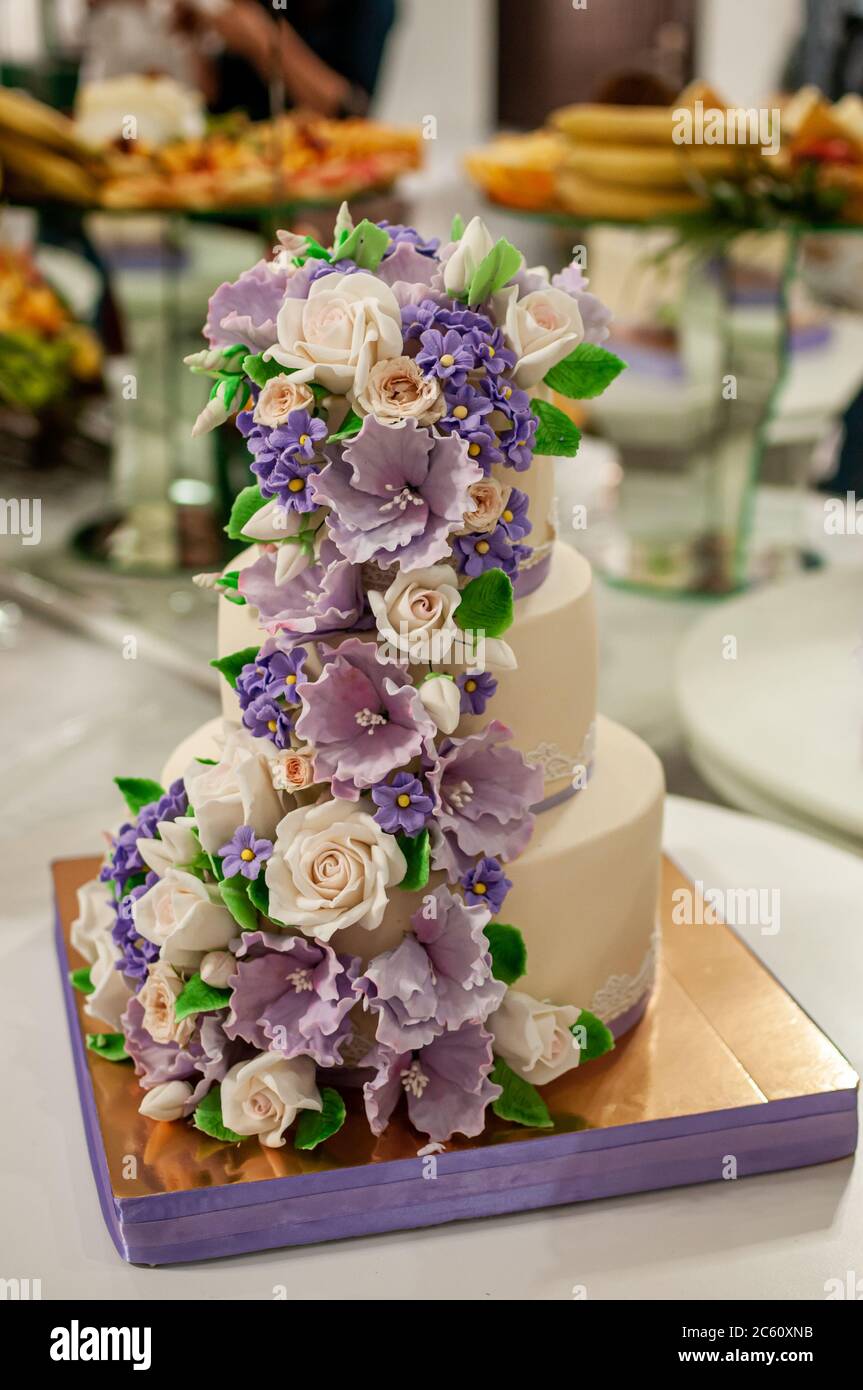 Wedding cake decorated with flowers Stock Photo Alamy