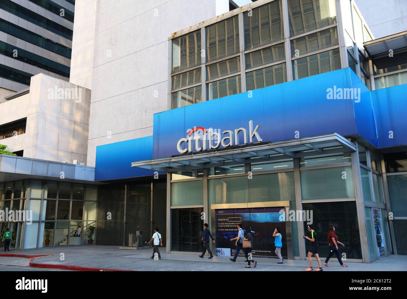 MANILA, PHILIPPINES - NOVEMBER 28, 2017: People walk by Citibank branch in Manila, Philippines. The bank is part of Citigroup, American investment gro Stock Photo