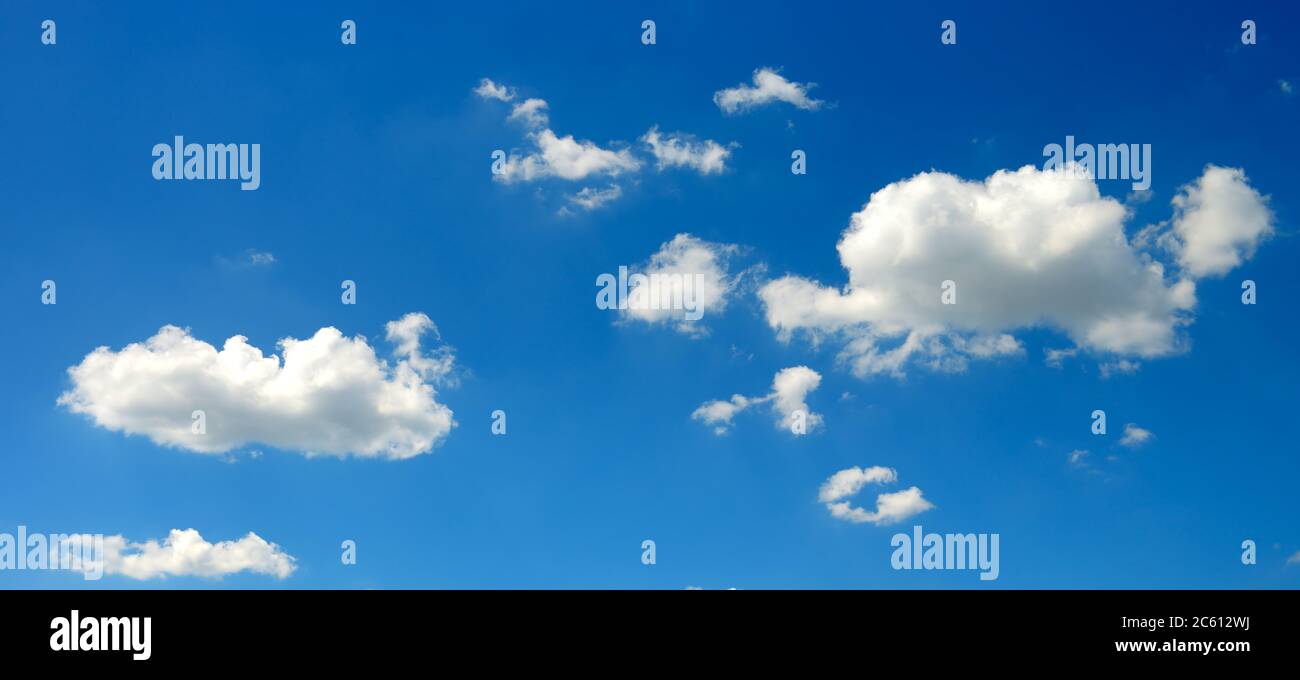 Panoramic photo white fluffy clouds on bright blue sky background Stock ...