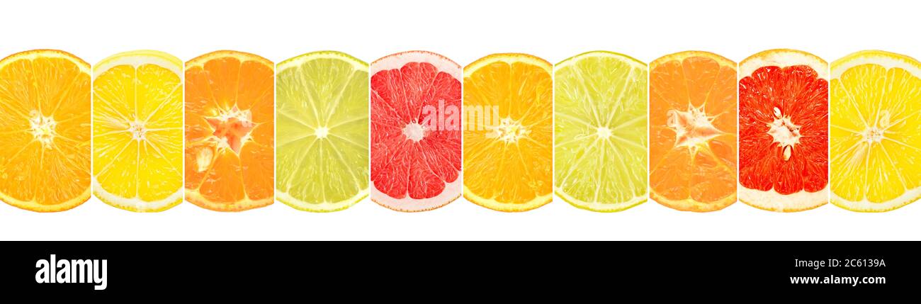 Sliced citrus fruits divided vertical lines isolated on white background. Stock Photo