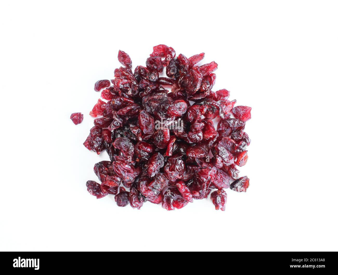 Pile of dried cranberries isolated on white background. Burgundy color