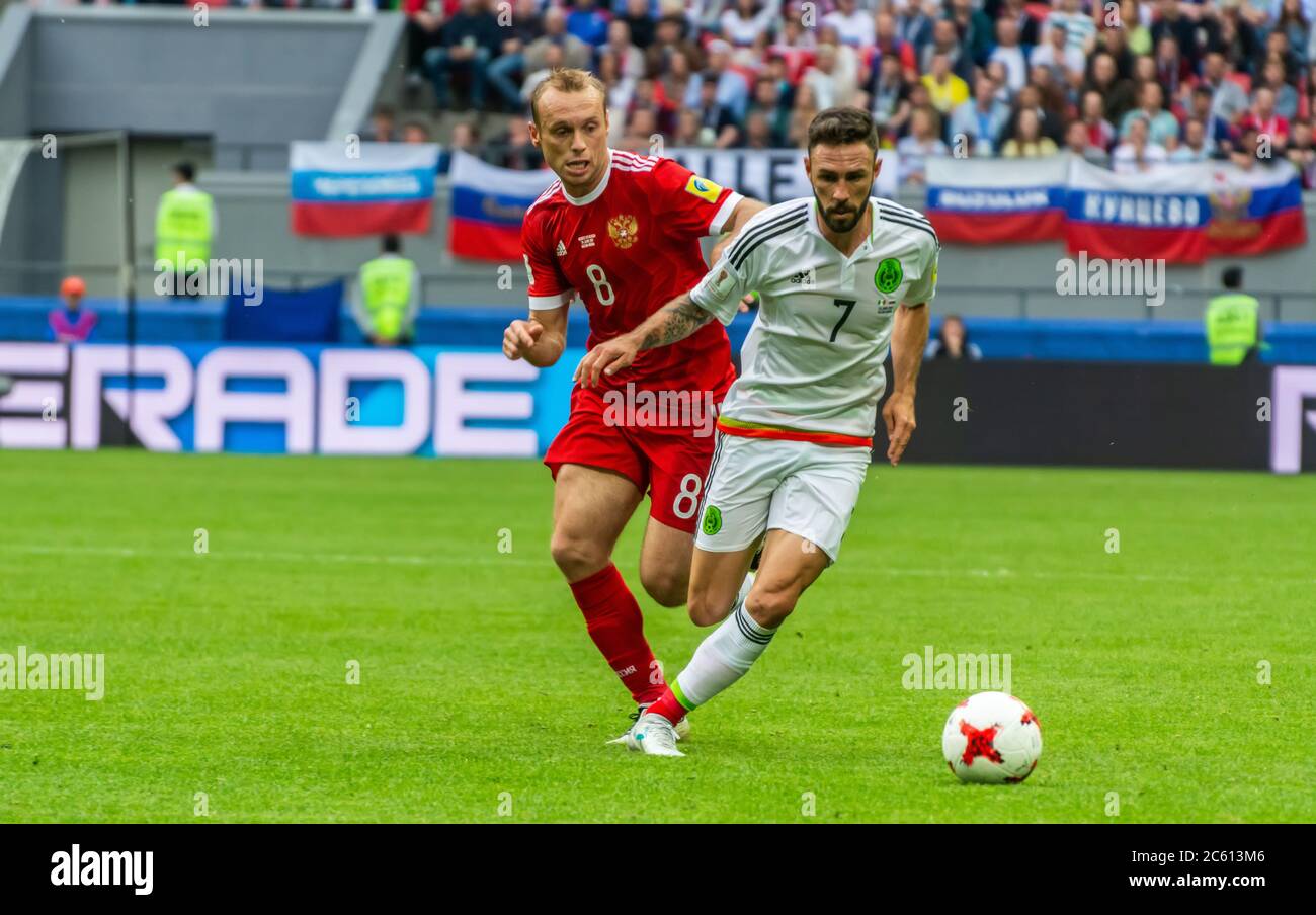Kazan, Russia – June 24, 2017. Russia national football team midfielder Denis Glushakov and Mexico winger Miguel Layun during FIFA Confederations Cup Stock Photo