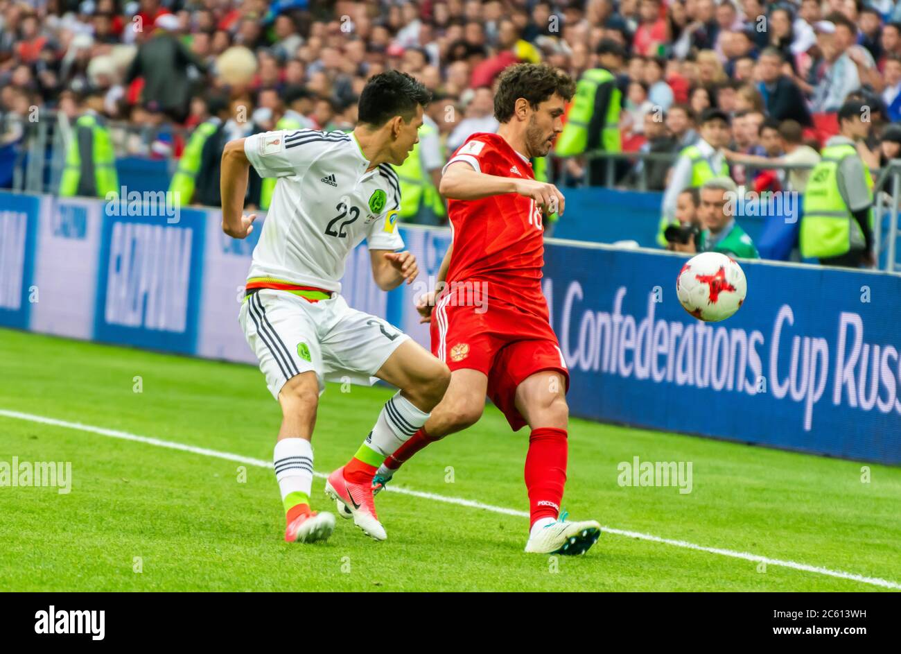 Kazan, Russia – June 24, 2017. Russia national football team midfielder Yury Zhirkov and Mexico winger Hirving Lozano during FIFA Confederations Cup Stock Photo