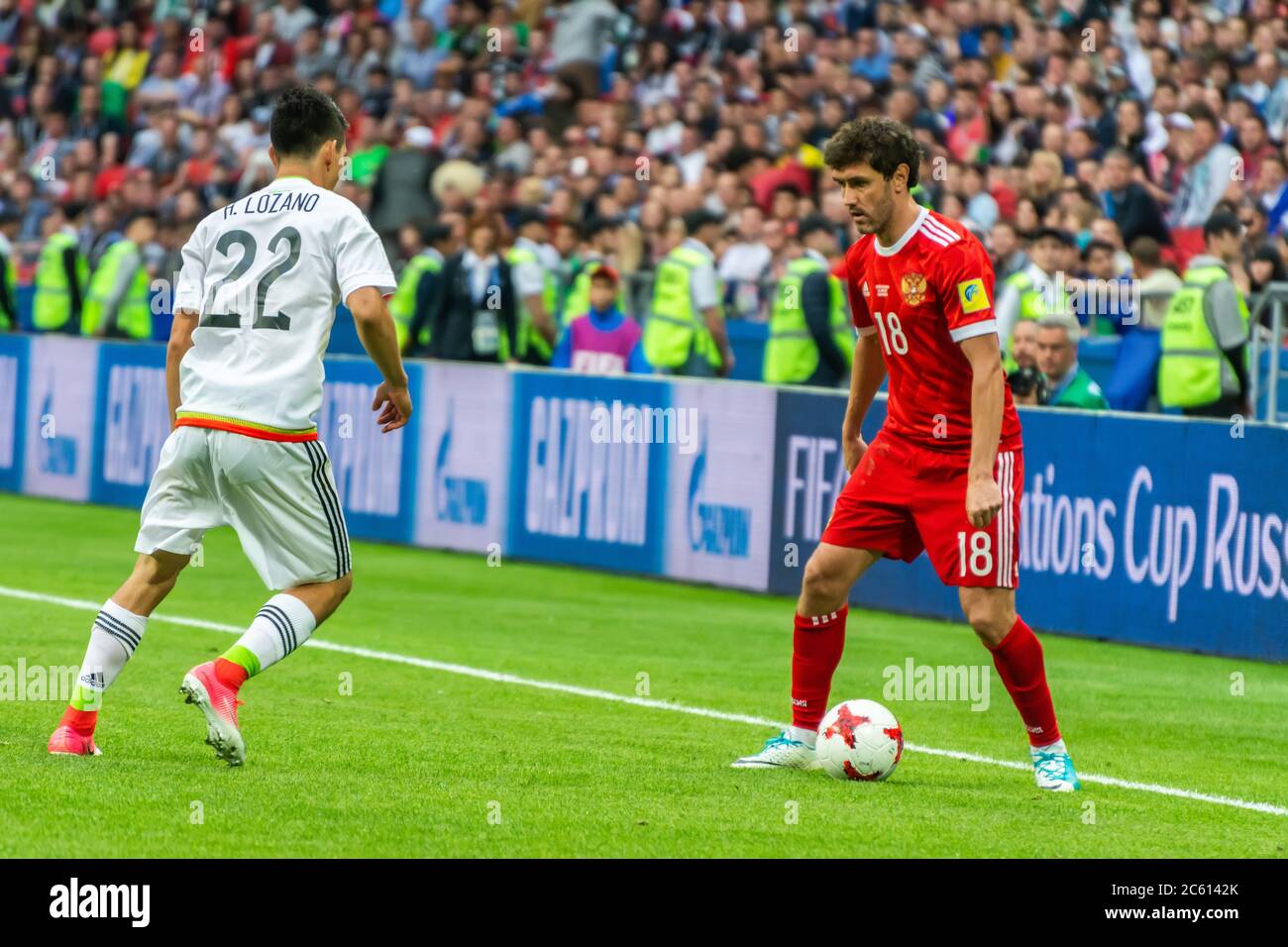 Kazan, Russia – June 24, 2017. Russia national football team midfielder Yury Zhirkov and Mexico winger Hirving Lozano during FIFA Confederations Cup Stock Photo