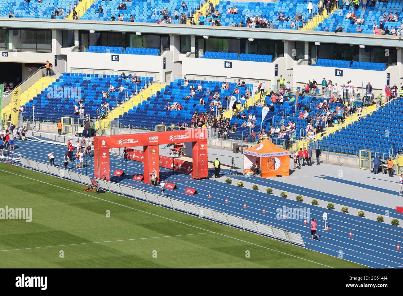 KATOWICE, POLAND - OCTOBER 1, 2017: Runners finish the PKO Silesia Marathon at Silesian Stadium in Katowice, Poland. The marathon had 2,500 participan Stock Photo