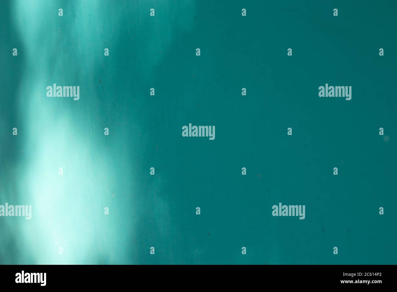 Blue textured wall background with shadow. Copy space Stock Photo