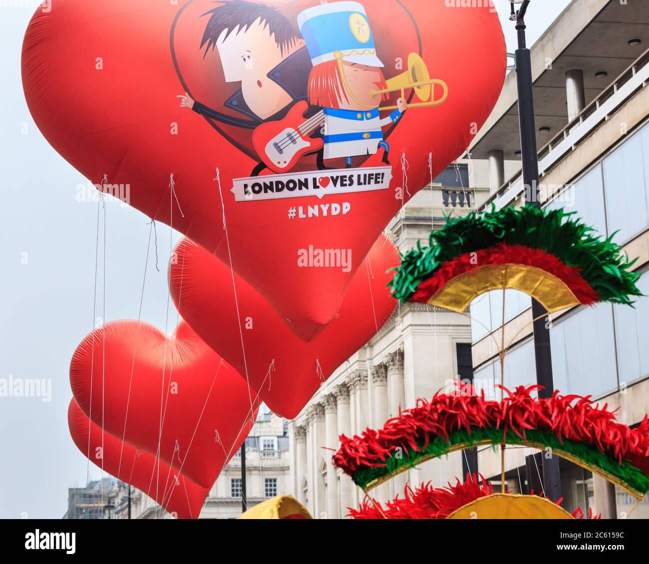 Giant heart balloons with 'London Loves Life', the 2020 theme of the London New Year's Day Parade (LNYDP), England Stock Photo
