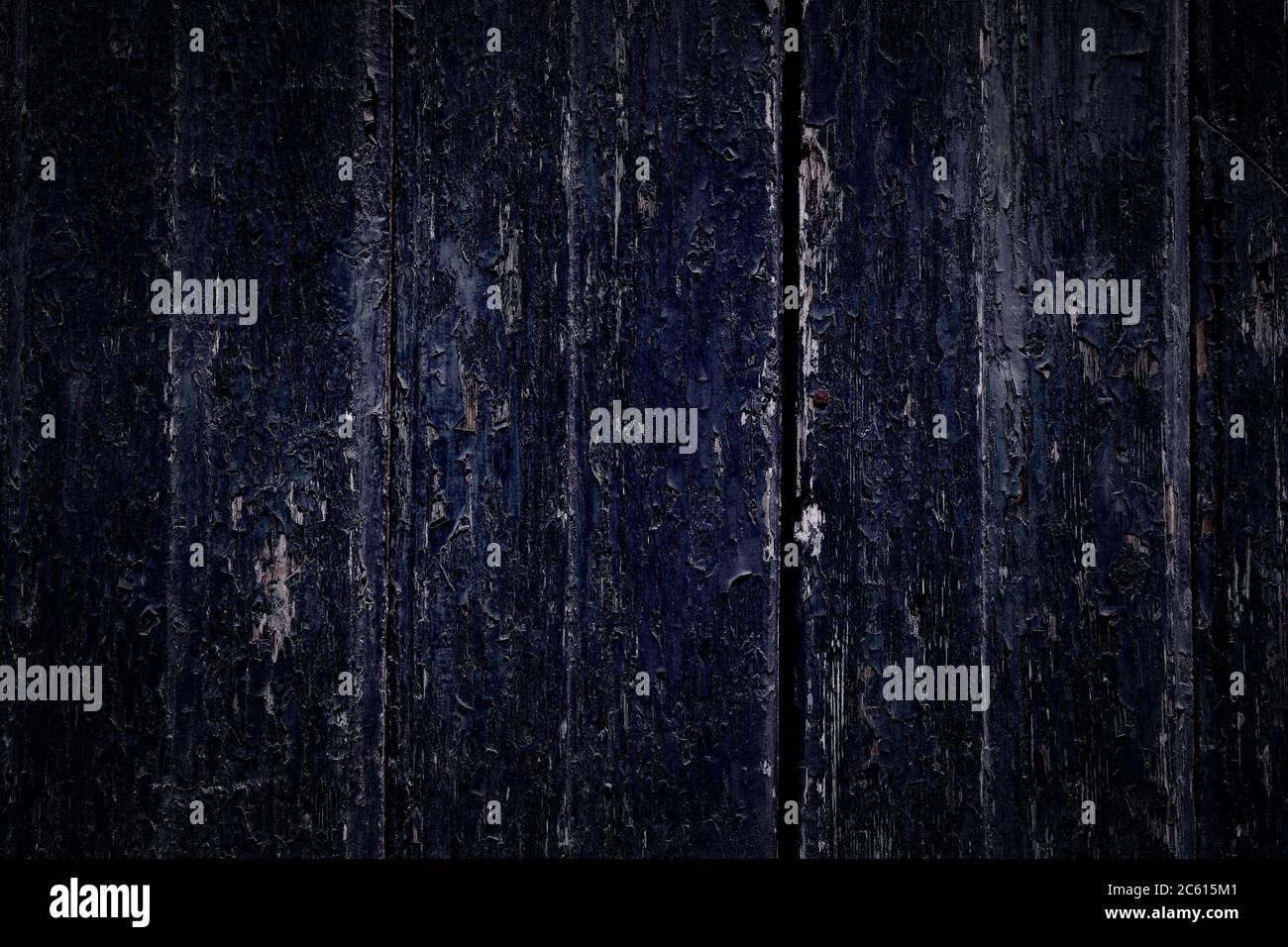 Dark distressed blue wood texture. Grunge distressed wooden door boards