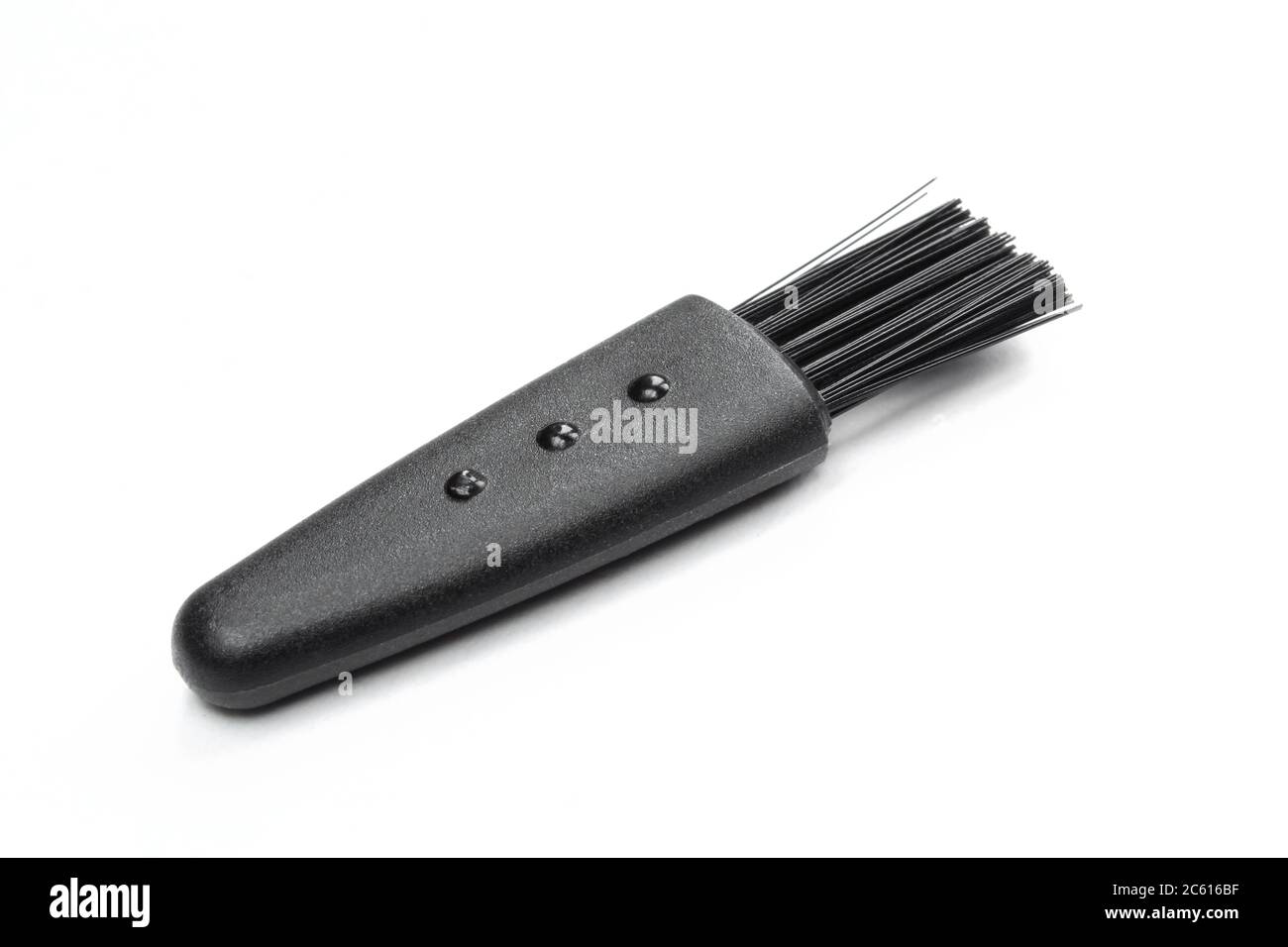 Black plastic brush isolated on white background. Tiny cleaning tool Stock Photo