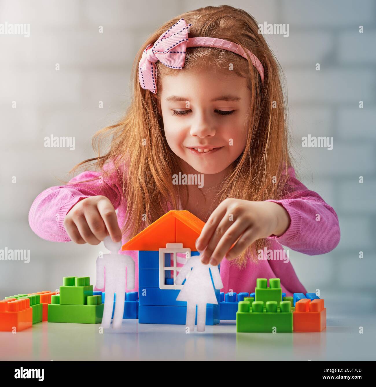 little child playing with toys Stock Photo - Alamy