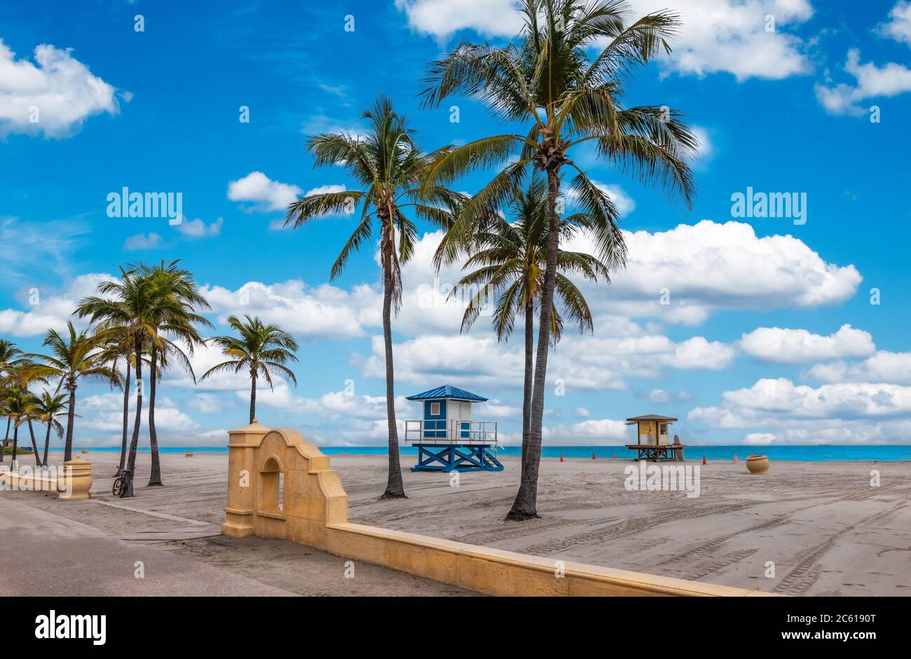 Hollywood Beach with tropical coconut palm trees and boardwalk in Florida. Stock Photo