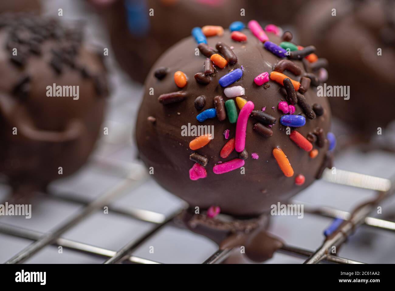 Chocolate donut holes with sprinkles Stock Photo Alamy