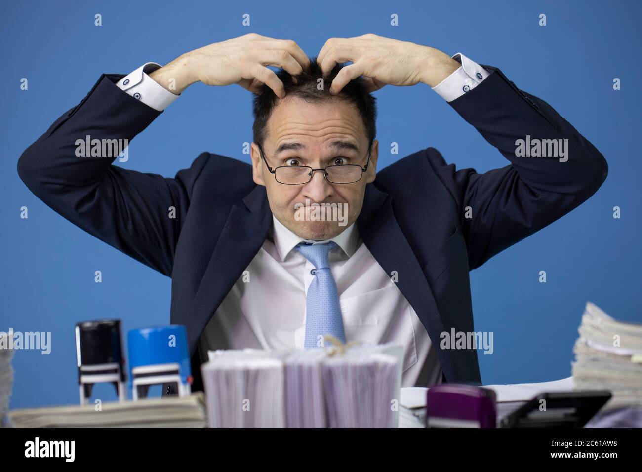 Office worker scratching head hires stock photography and images Alamy