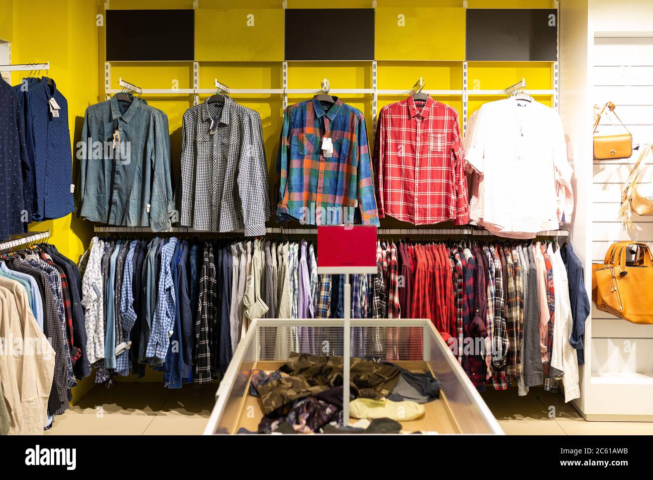 clothing store with a large assortment of shirts Stock Photo Alamy