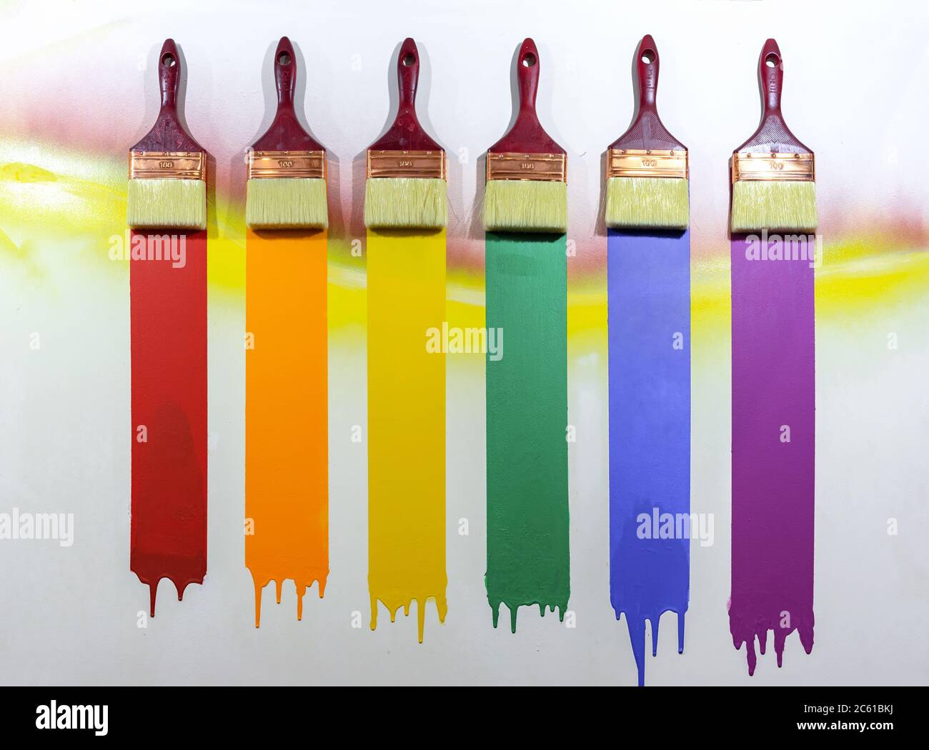 Paint brushes with multi-colored samples of paints. Stock Photo