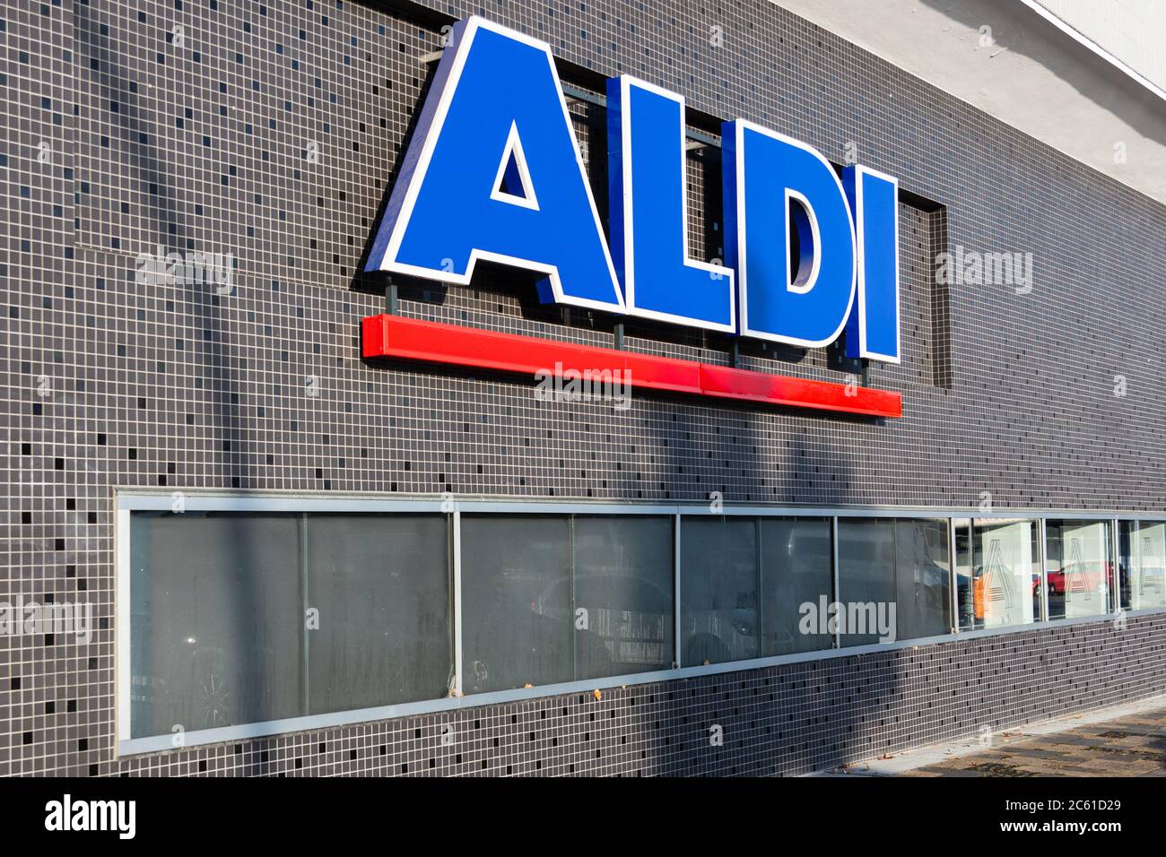 Aldi lettering on a wall of the discounter in Berlin. Aldi is one of the most represented supermarkets in Berlin Stock Photo