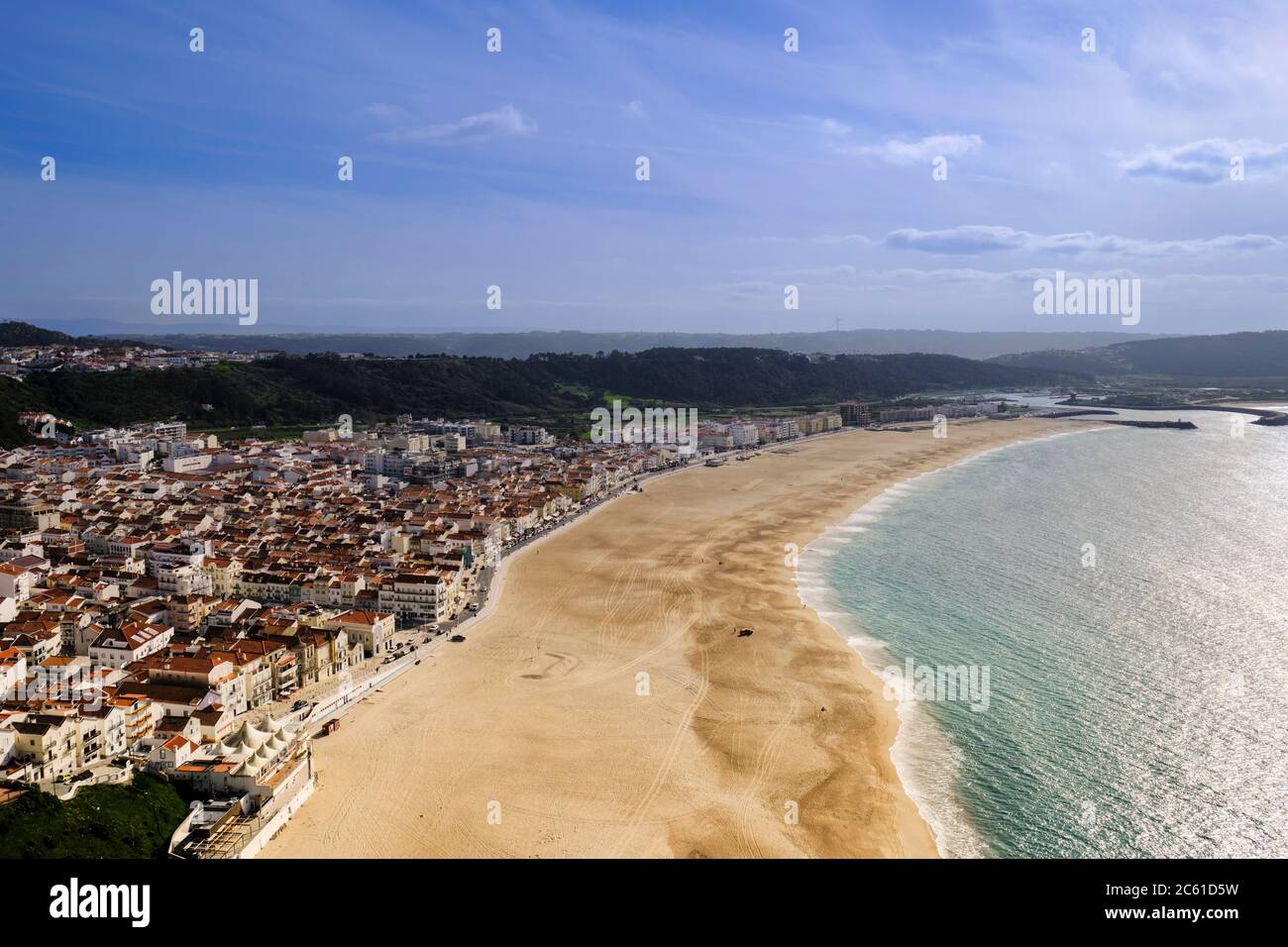 View of beach waterfront of Nazaré town taken from near the Fort of São Miguel Arcanjo in Nazaré Sitio which is connect to the town by a funicular. Stock Photo
