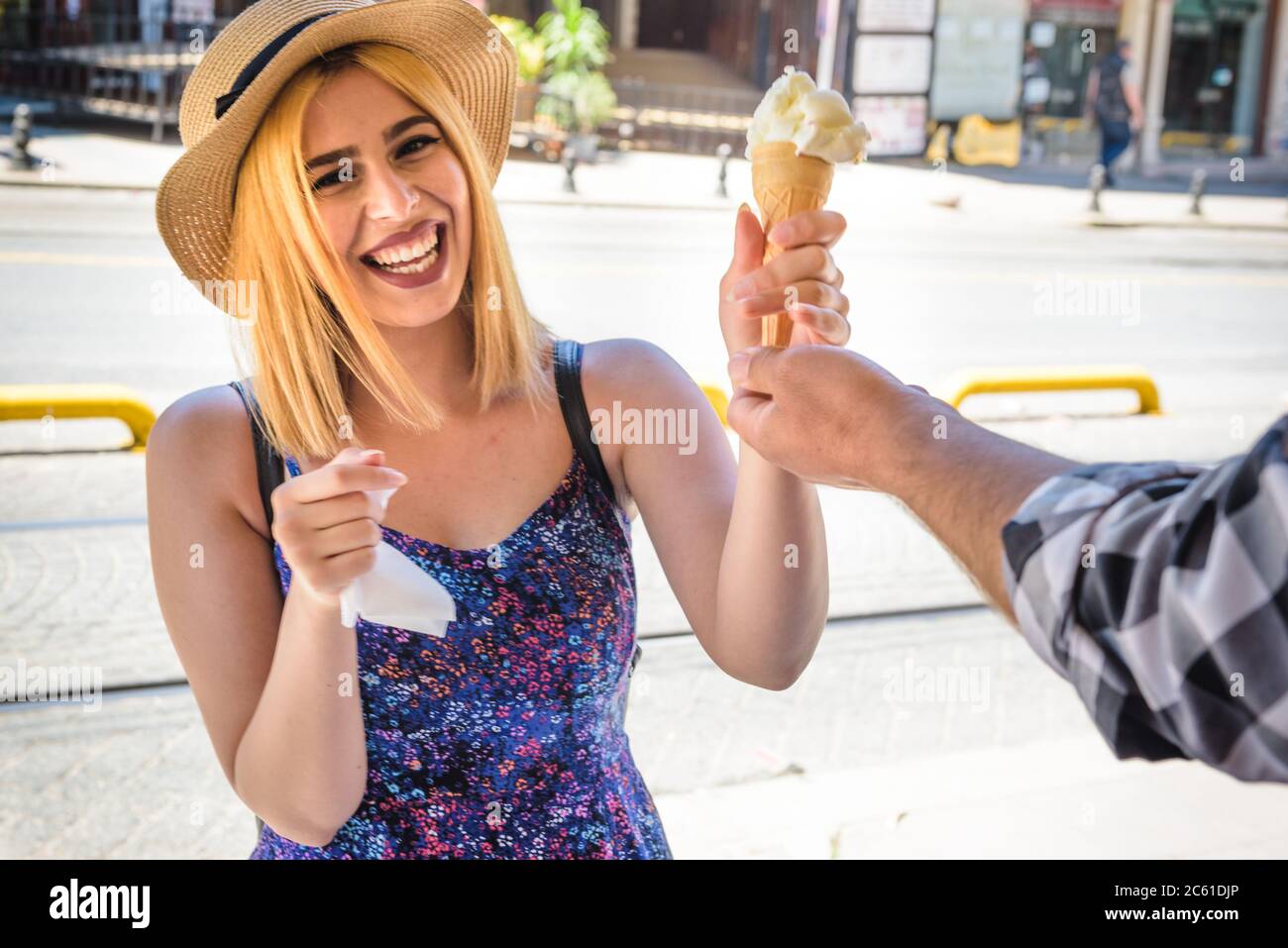 Beautiful young girl in fashionable clothes laughs because of Ice cream  seller man playing traditional Turkish joke in Istanbul,Turkey Stock Photo  - Alamy