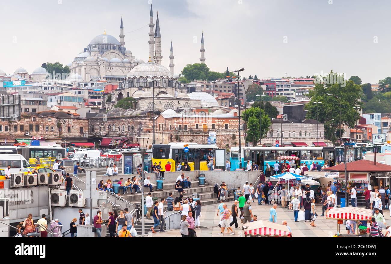 Istanbul, Turkey - June 28, 2016: Istanbul city view, Eminonu former district. People are on the coast of Golden Horn, Suleymaniye Mosque is on a back Stock Photo
