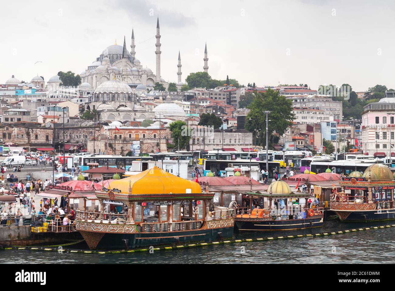 Istanbul, Turkey - June 28, 2016: Istanbul street view, Eminonu former district. Ordinary people are on the coast of Golden Horn, Suleymaniye Mosque i Stock Photo