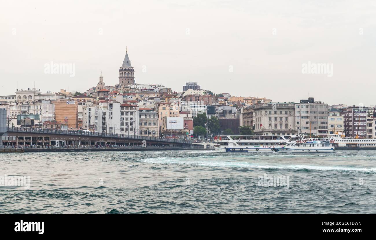 Istanbul, Turkey - June 28, 2016: Cityscape with Galata bridge and Beyoglu district, located at the northern part of the Golden Horn. Galata tower is Stock Photo
