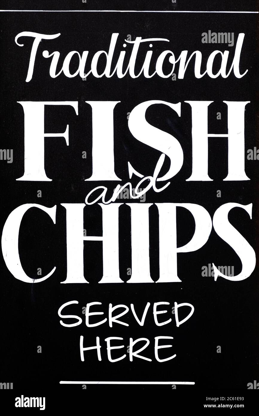 United Kingdom, England. Fish and Chip shop sign outside a pub restaurant Stock Photo