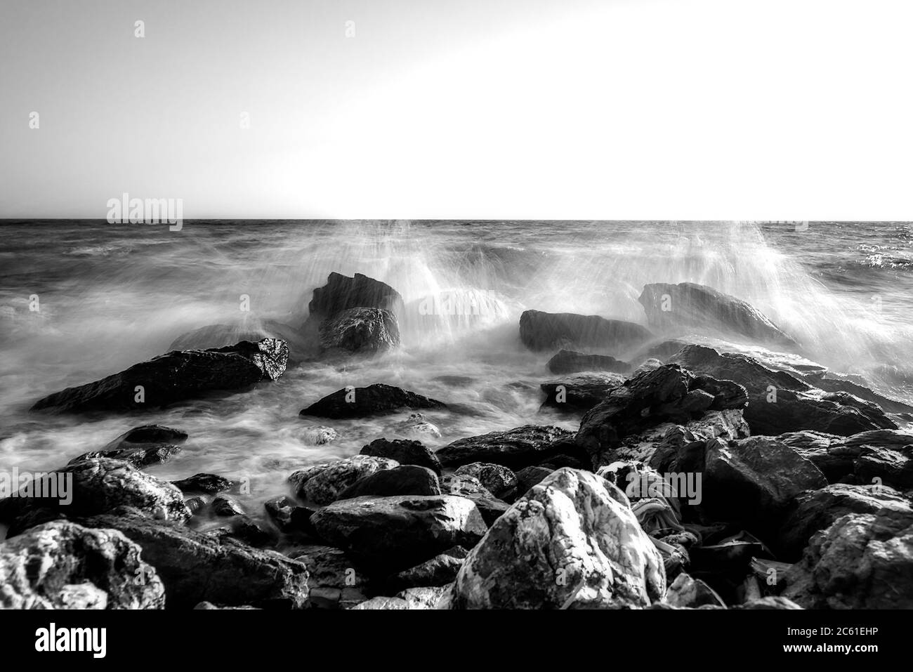 Photographing the waves that hit the rocks in a stormy weather with a